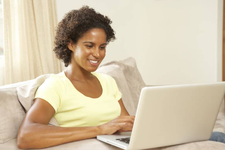 Happy relaxed woman working